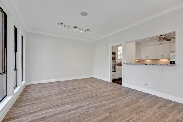 a kitchen with a stove a sink and a granite counter tops