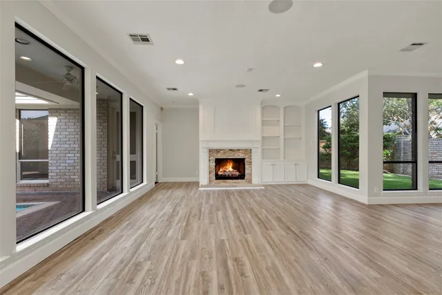 wooden floor in an empty room with a window