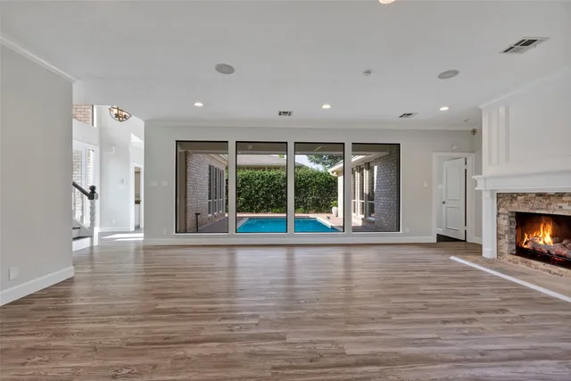 a bathroom with a granite countertop sink and a toilet