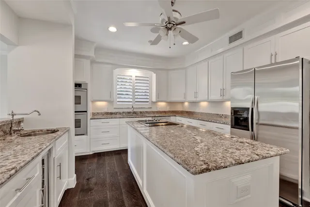 a spacious bathroom with a tub sink and mirror