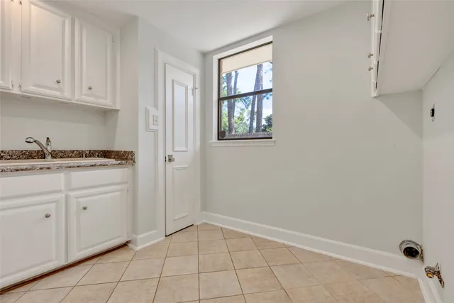 a view of a house with a large window and wooden floor