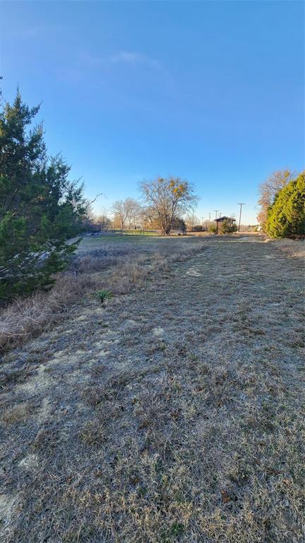905 Zion Hill Road, Unit B Weatherford, TX 76088 - Photo 10 of 23 a view of a yard in a field