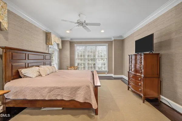 a bathroom with a sink a toilet a mirror and shower