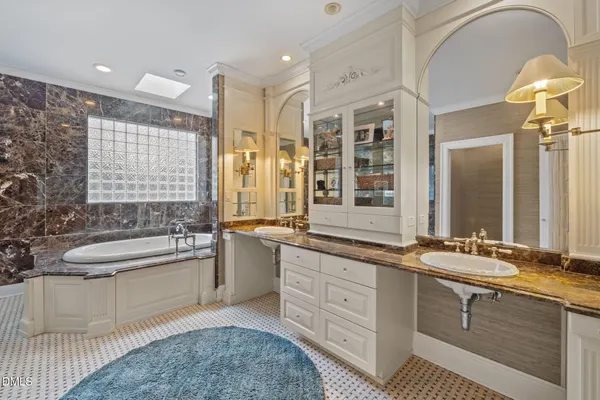 a reading room with furniture a rug and a bookshelf