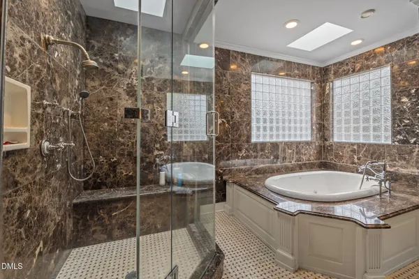 a bedroom with a bed and windows