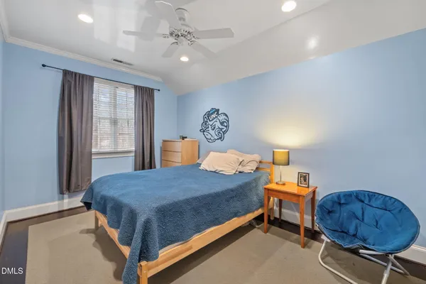 a bathroom with a sink a toilet and shower curtain