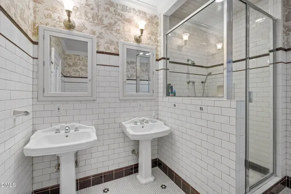 a bathroom with a shower and a shower