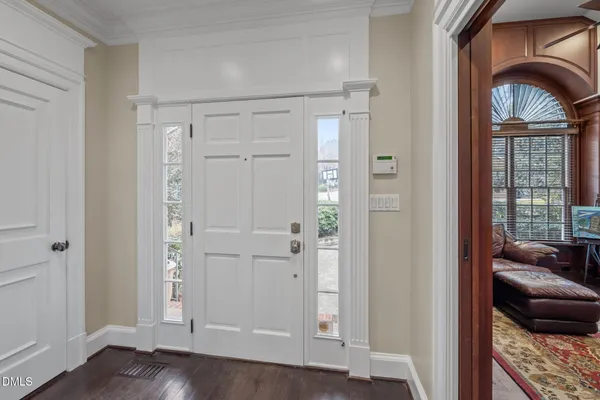 a view of livingroom with entryway and wooden floor
