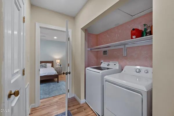 a view of a wooden deck and a yard with wooden fence