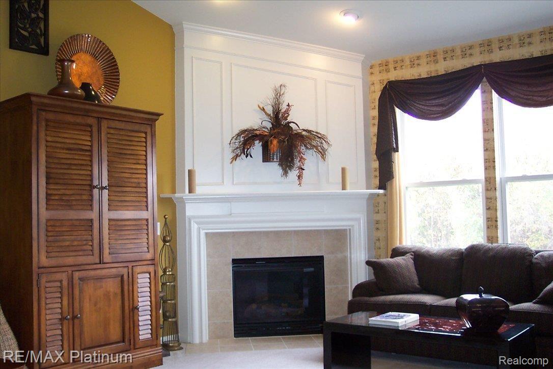 3983 Rainier Drive, Unit 2 Howell, MI 48843 - Photo 2 of 11 greatroom fireplace