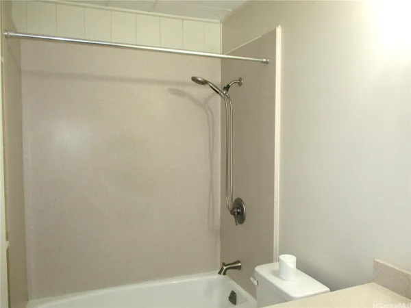 a bathroom with a sink and shower