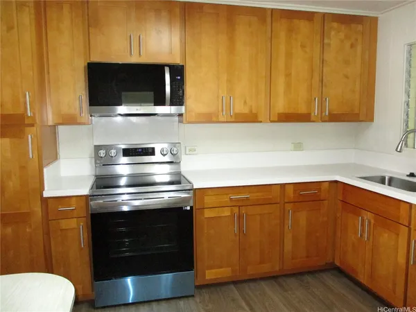 a kitchen with a sink and a microwave