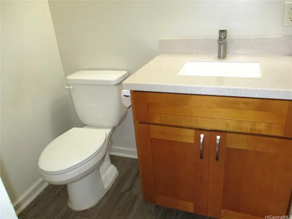 a bathroom with a toilet and a sink