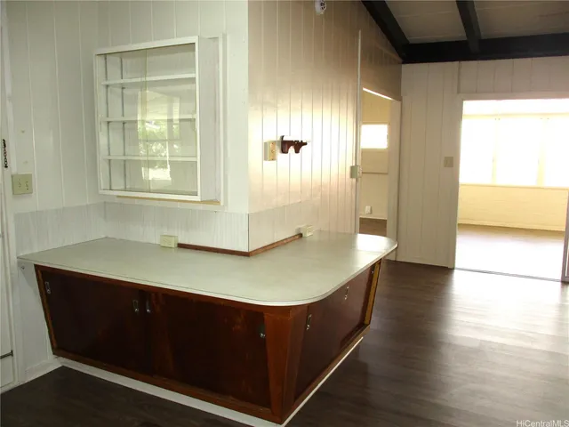 a room with wooden floor and window