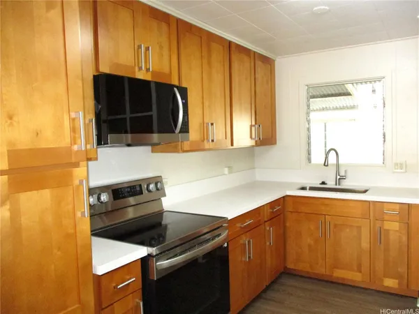 a kitchen with a sink and cabinets