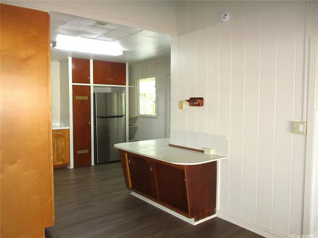 a kitchen with a sink and refrigerator