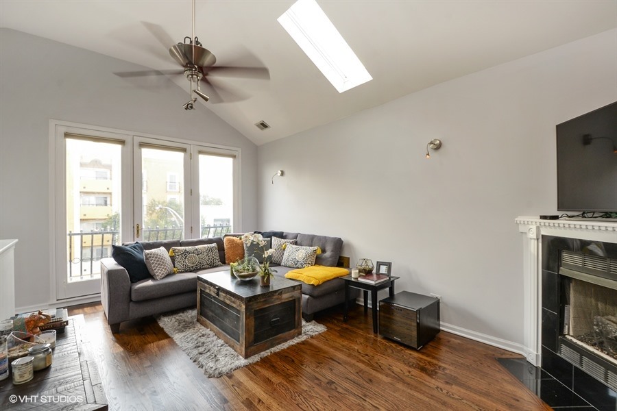 2508 West Division Street, Unit 3 Chicago, IL 60622 - Photo 4 of 10 a living room with furniture and a fireplace