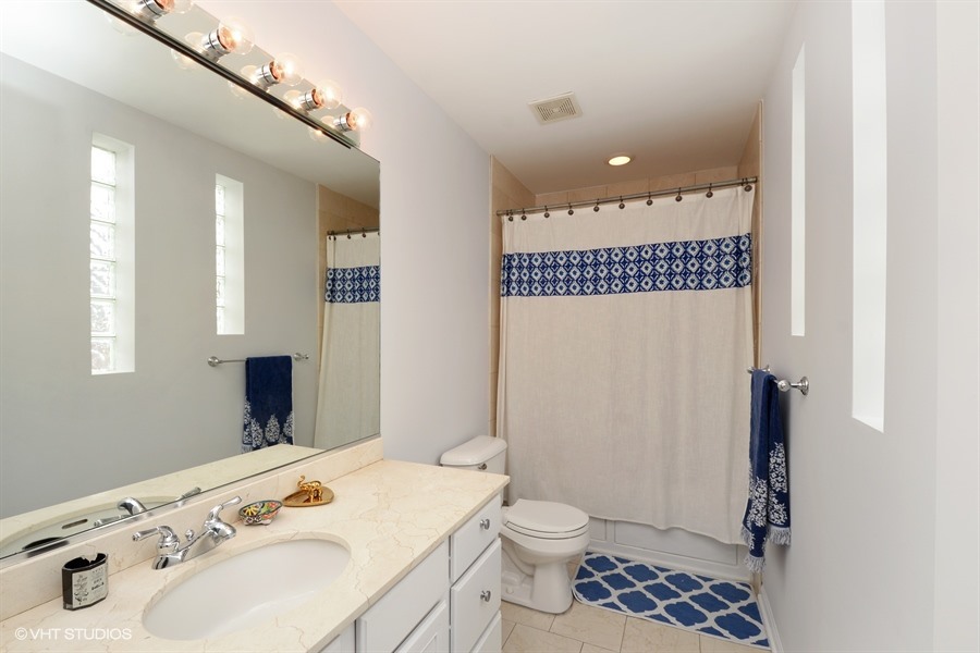 2508 West Division Street, Unit 3 Chicago, IL 60622 - Photo 7 of 10 a bathroom with a sink a toilet and shower