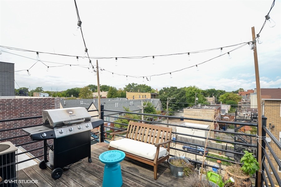 2508 West Division Street, Unit 3 Chicago, IL 60622 - Photo 10 of 10 a view of a balcony with mountain view and wooden floor