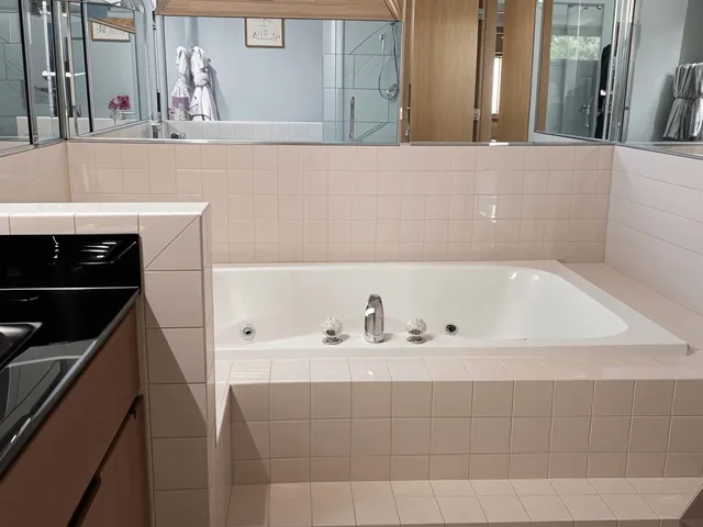 a bathroom with a bathtub and a sink