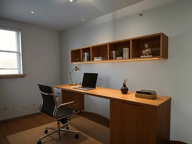 a work room with furniture and windows