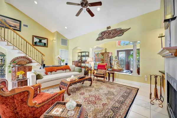a view of a dining room with furniture and a chandelier
