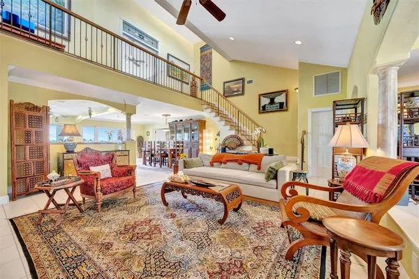 a kitchen with stainless steel appliances kitchen island granite countertop a table and chairs in it