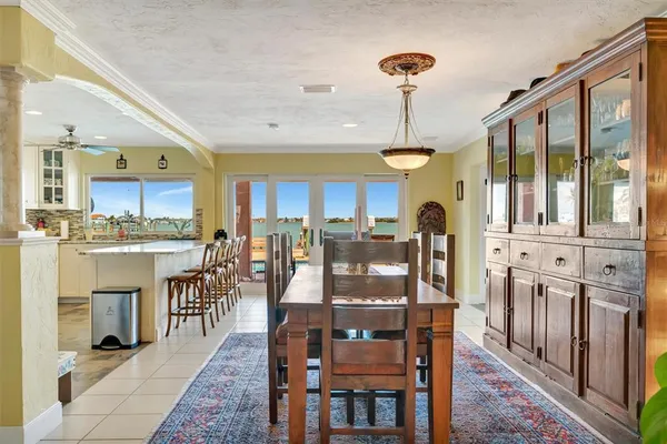 a large kitchen with cabinets a sink and appliances in it