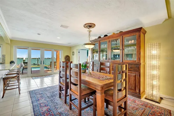 a living room with table or chairs and a floor to ceiling window