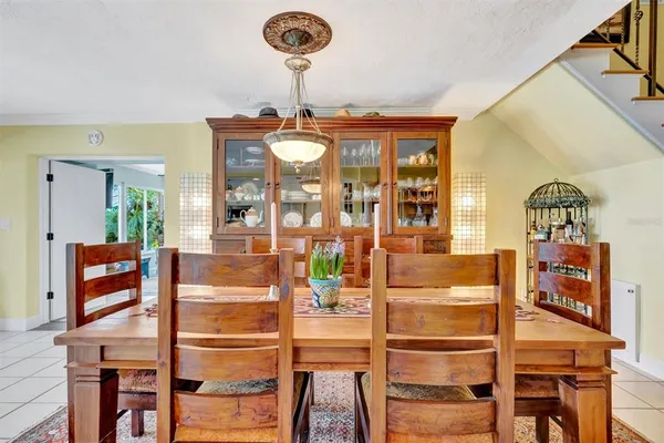 a view of a swimming pool with lawn chairs and a yard