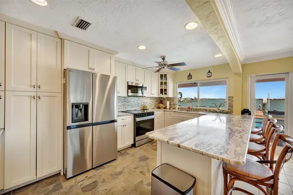 a view of a porch with a table and chairs