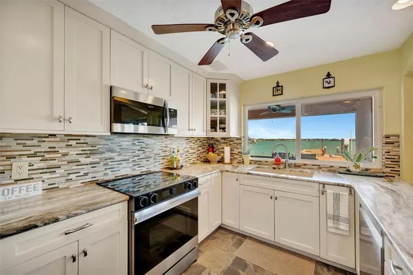 a bedroom with furniture and a flat screen tv