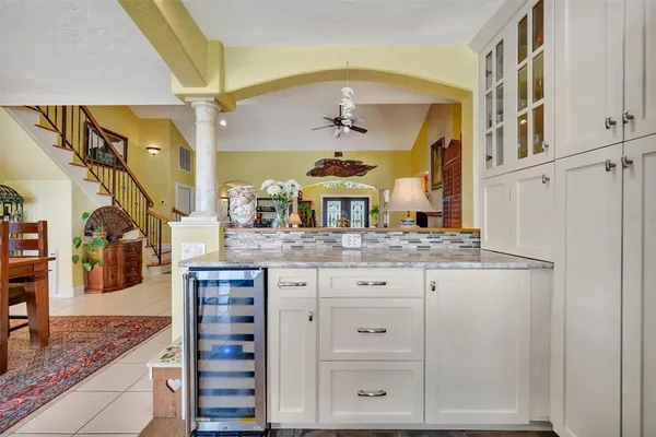 a bathroom with a tub sink and mirror