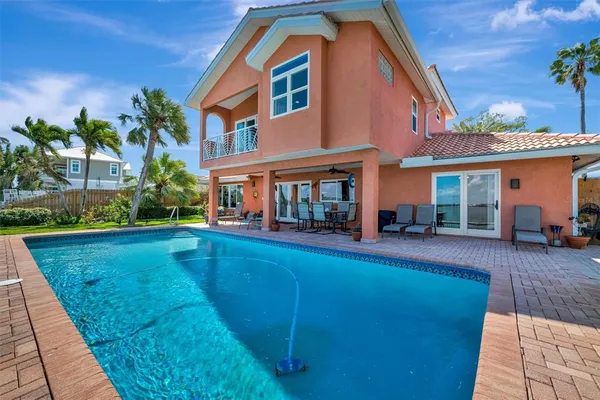 a living room with furniture and a book shelf