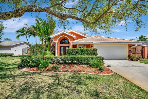 a living room with fireplace furniture and a large window
