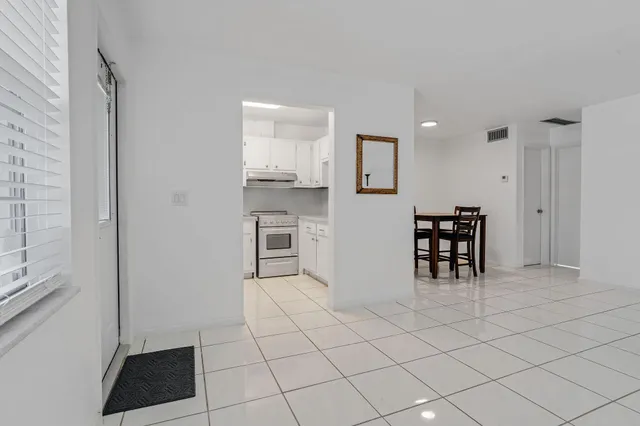 a view of kitchen with furniture and window