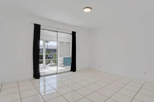 an empty room with sliding door