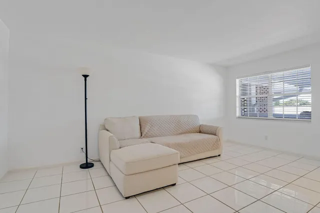 a living room with furniture and window