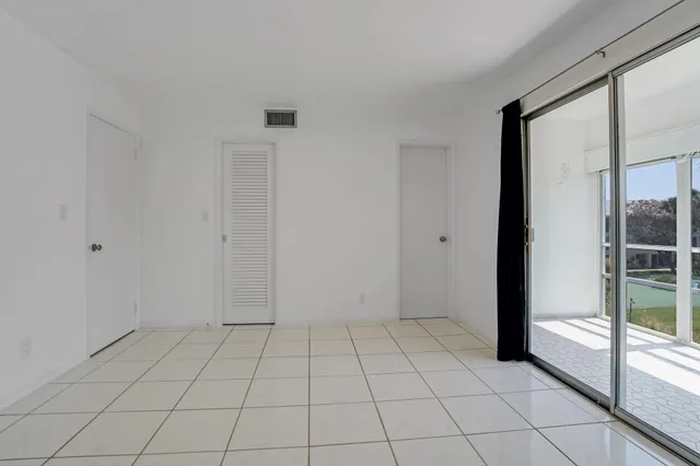 a view of an empty room and window in a room