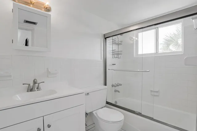 a bathroom with a toilet and a sink