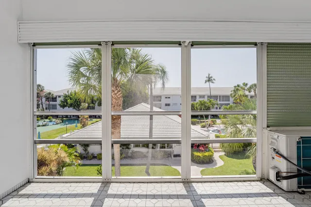 a view of balcony with wooden floor