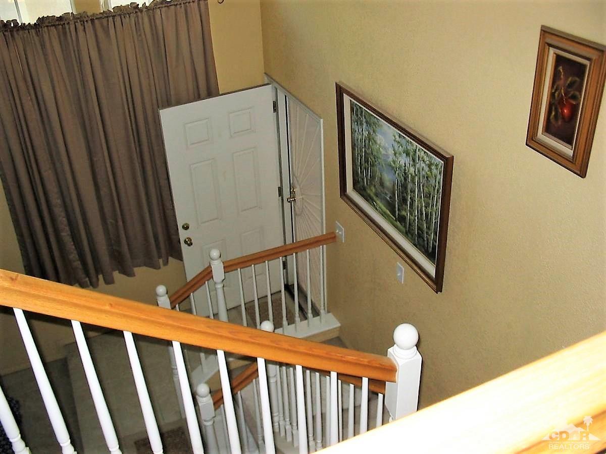 23680 Blooming Meadow Road Moreno Valley, CA 92557 - Photo 11 of 22 a stairs of a house with wooden floor