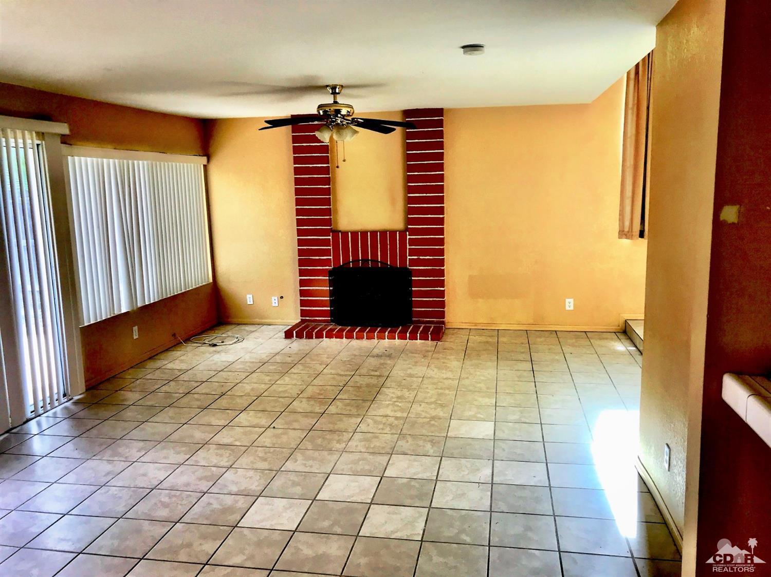 23680 Blooming Meadow Road Moreno Valley, CA 92557 - Photo 21 of 22 a view of an empty room with a window