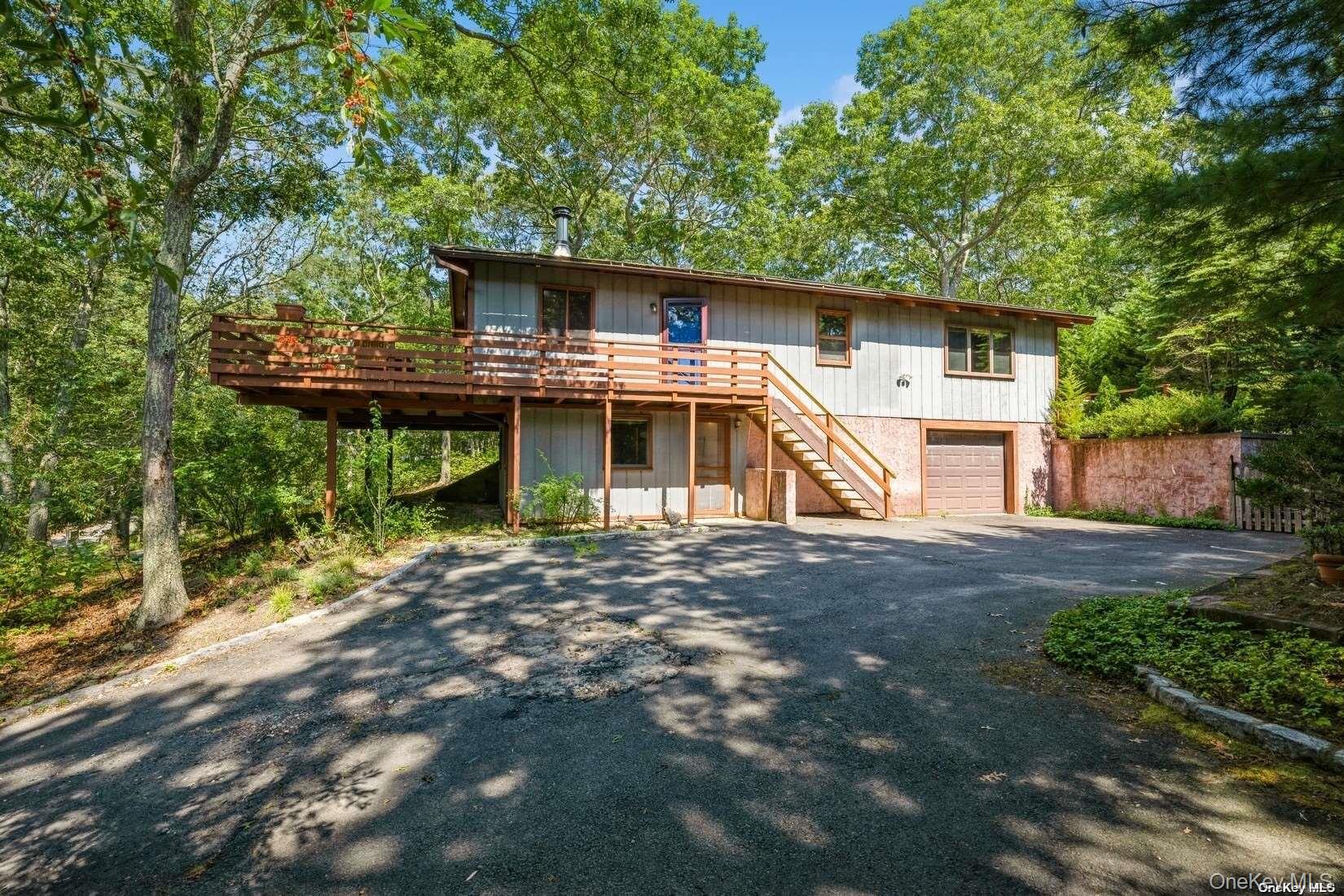 292 Little Fresh Pond Road Southampton, NY 11968 - Photo 11 of 46 Side Of House With 1 Car Attached Garage