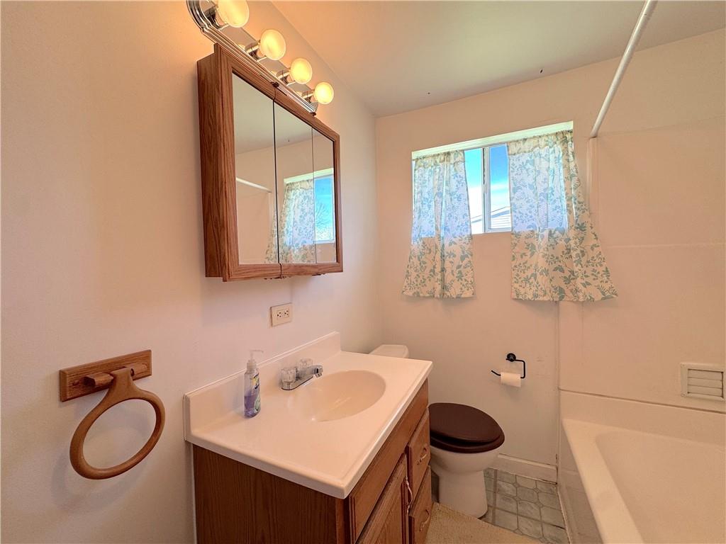 3003 Riverside Drive Claridge, PA 15623 - Photo 21 of 28 a bathroom with a sink a toilet and mirror