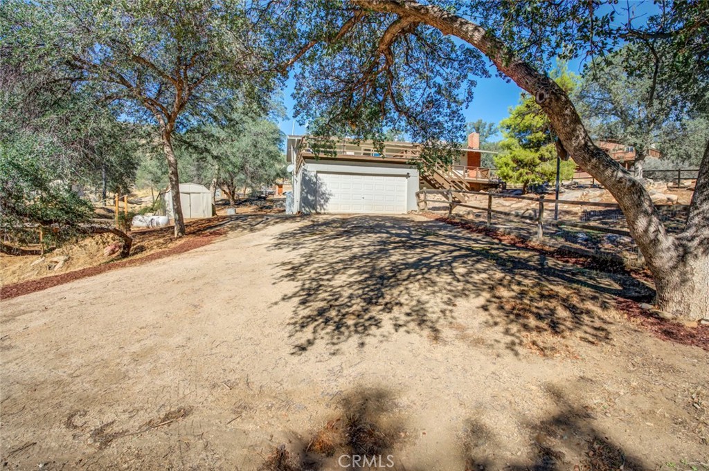 245 Mountain Shadow Road Wofford Heights, CA 93285 - Photo 31 of 72 a view of a house with a yard and garage