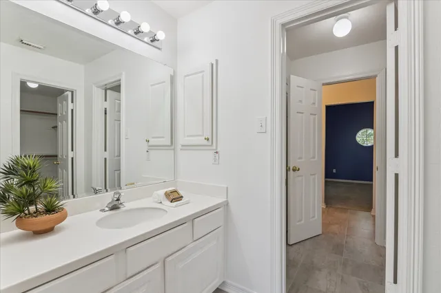 a bathroom with a sink and mirror