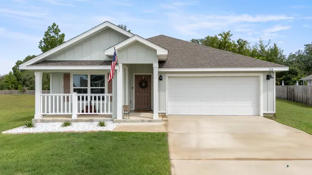 a front view of a house with garage