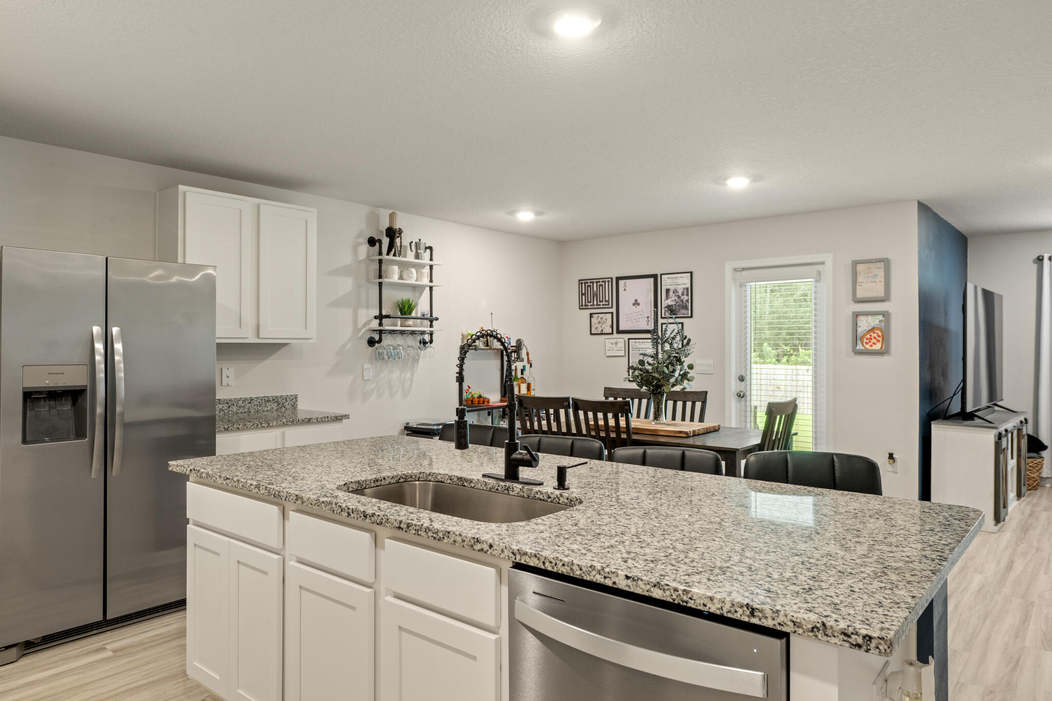 810 Otto Loop Crestview, FL 32539 - Photo 13 of 41 a kitchen with granite countertop a sink a counter top space and stainless steel appliances