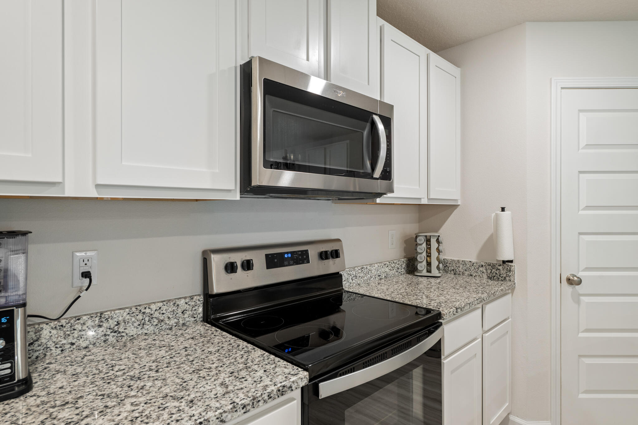 810 Otto Loop Crestview, FL 32539 - Photo 15 of 41 a kitchen with stainless steel appliances granite countertop a stove microwave and sink